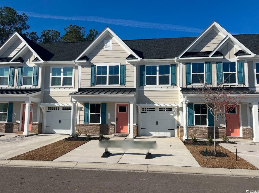 View of front of home featuring a garage