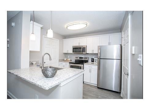 Kitchen featuring light hardwood / wood-style floo