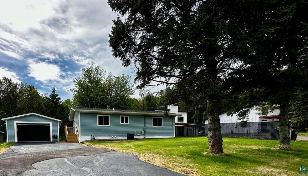 Ranch-style house with an outdoor structure, a fro
