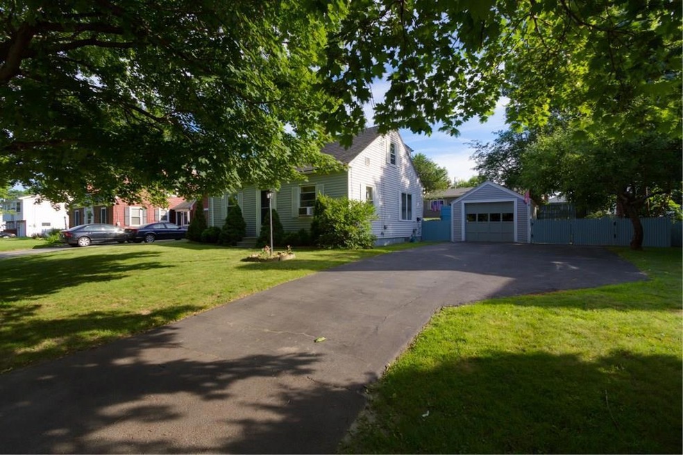 Exterior front showing paved...