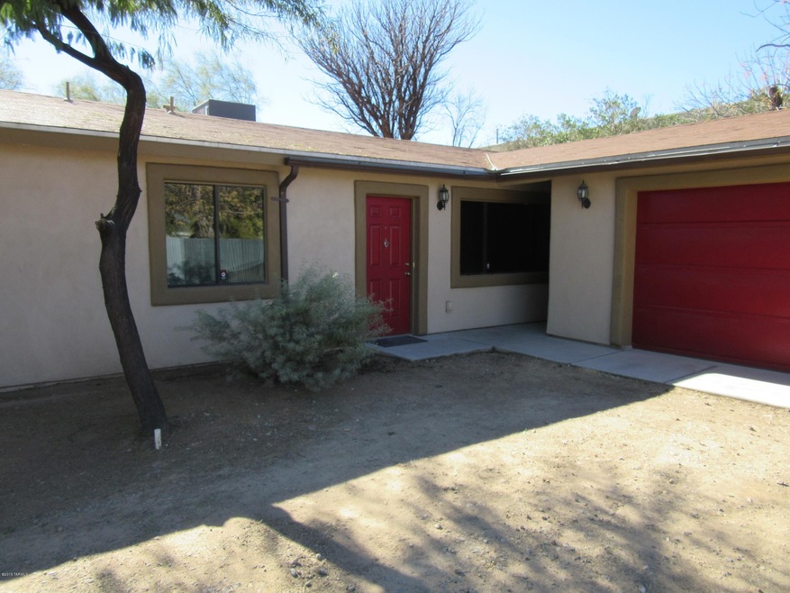 Front, home has three yards 2 patios