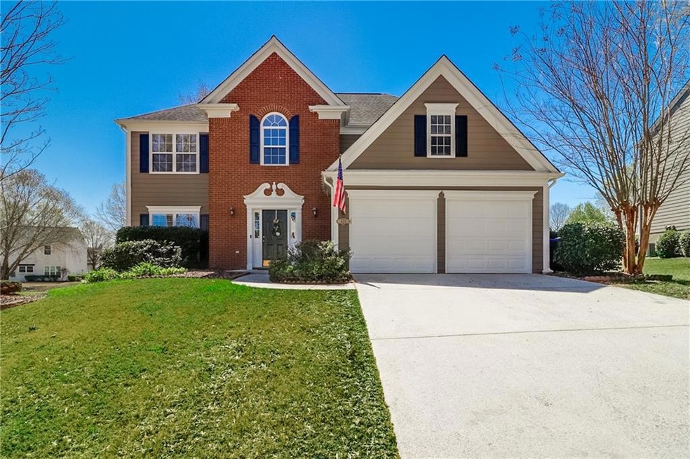 Front facade with a front lawn and a garage