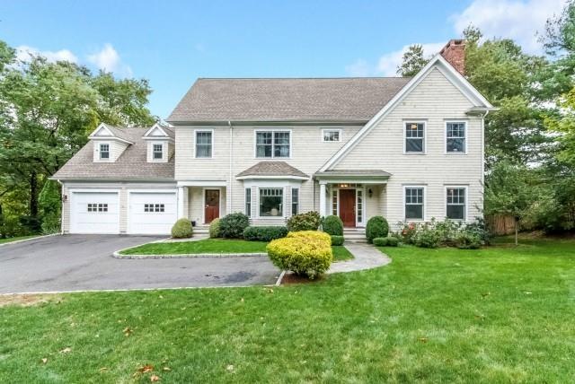 Spacious shingle-style colonial on wonderful half-