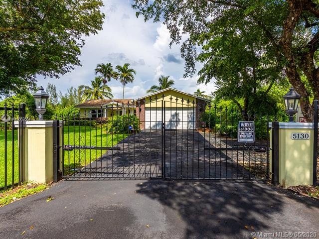 ENTER THROUGH ELECTRONIC WROUGHT IRON DOUBLE GATES