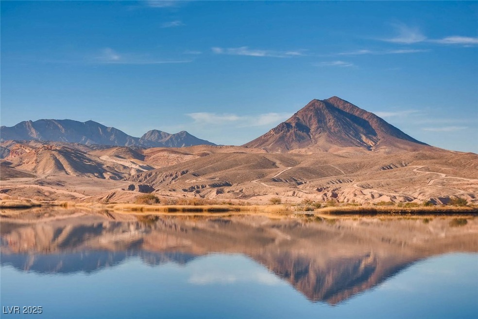 View of mountain backdrop with a nearby body of wa