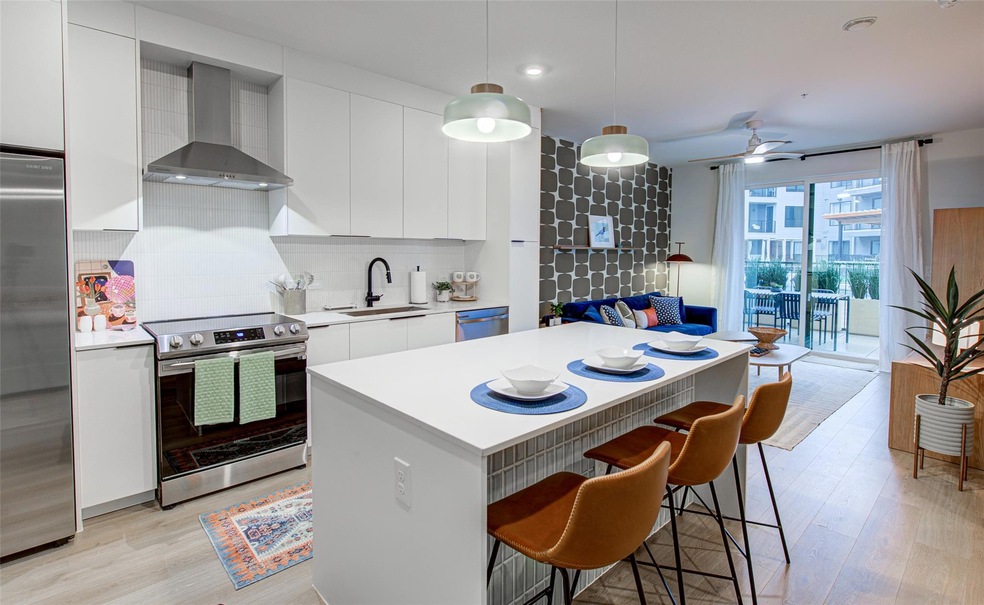 Kitchen featuring appliances with stainless steel