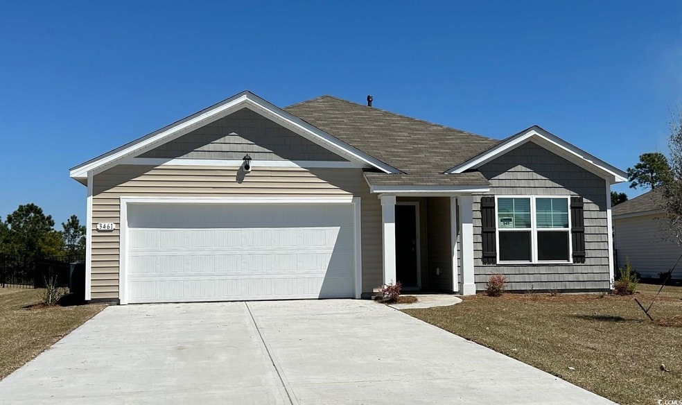 Ranch-style home with a garage and concrete drivew