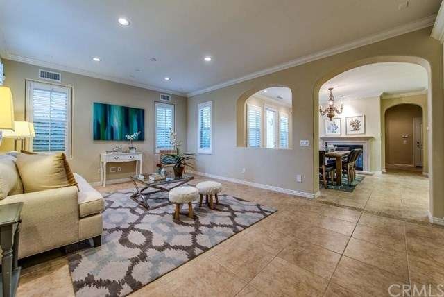 Large living room with a view into the dining room