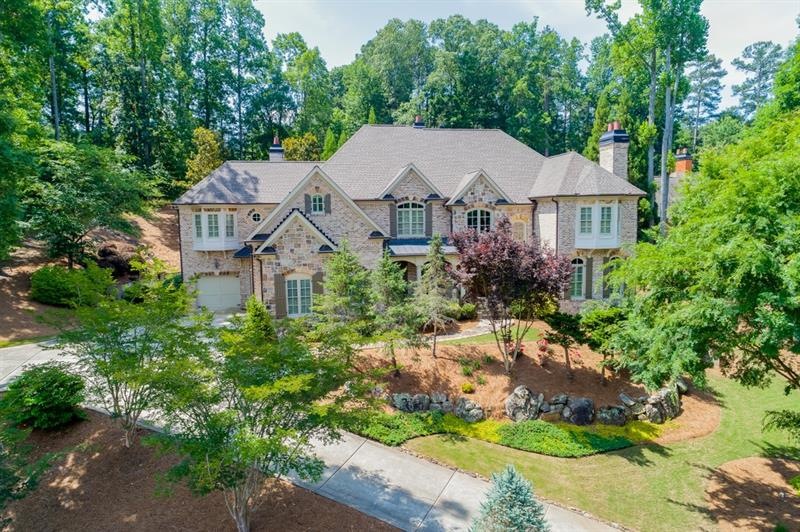 Stately 4 sided brick and stone, landscaped home i