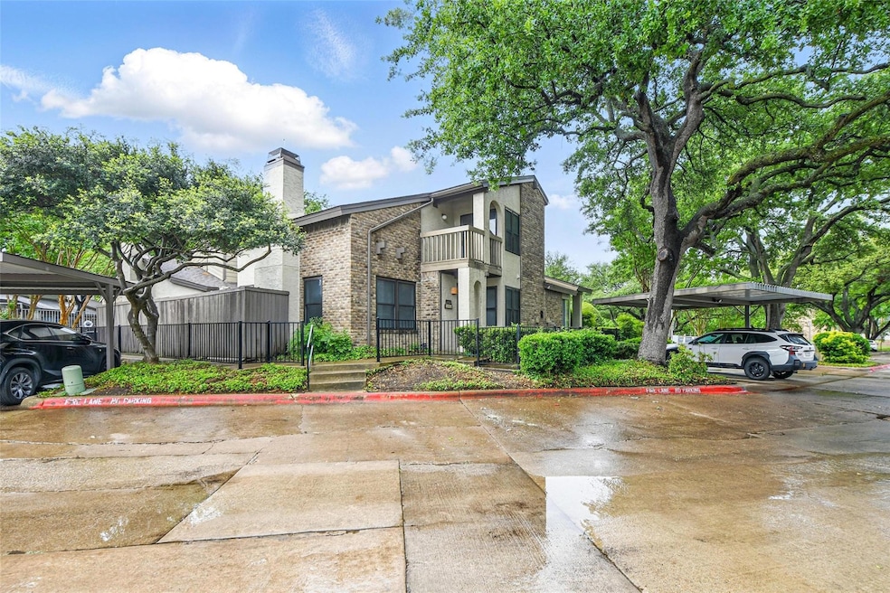 Home front view with grown trees, covered parking,