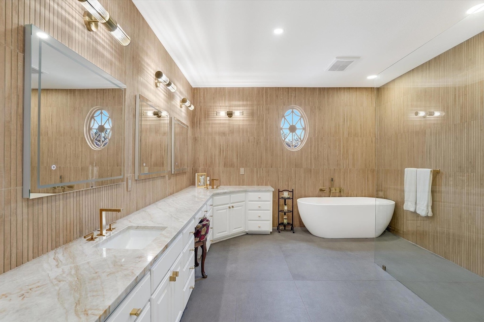 Full bathroom with visible vents, double vanity, 