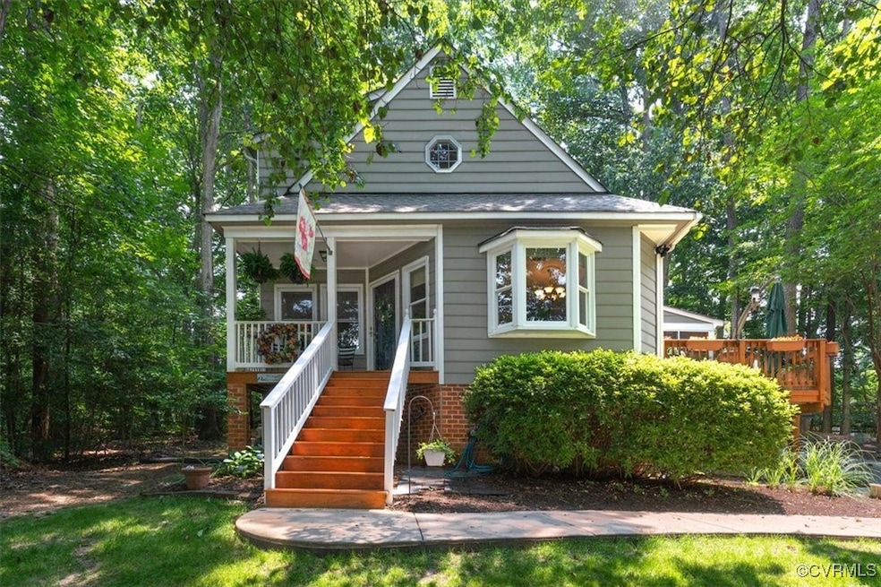 View of front of house with stairway, brick siding