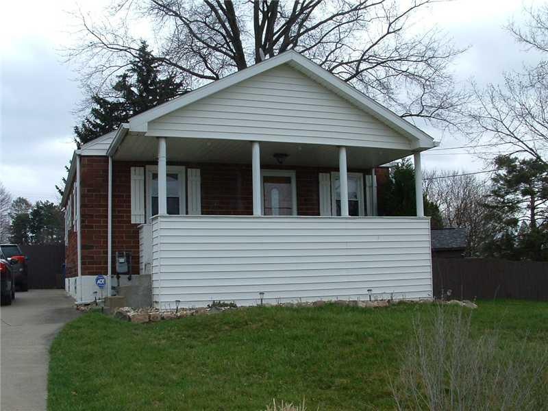 Exterior Front. Brick ranch with privacy fence