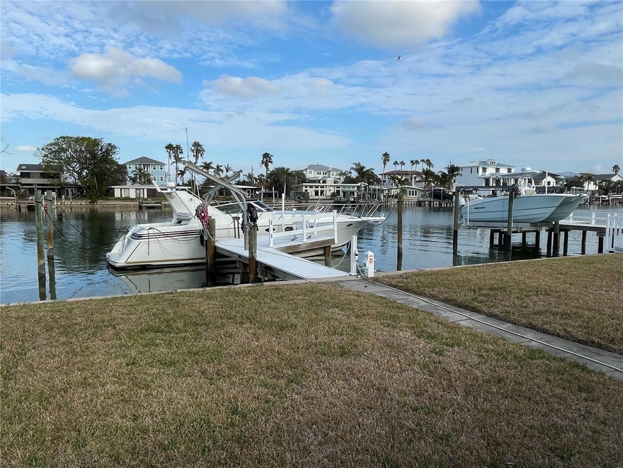 4 pole boat slip accommodates a 50' boat.  50 amp electric service and deep water access to gulf with no fixed bridges.  Additional davits for smaller boats as well.