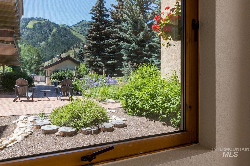 View of yard with a mountain view and a patio area