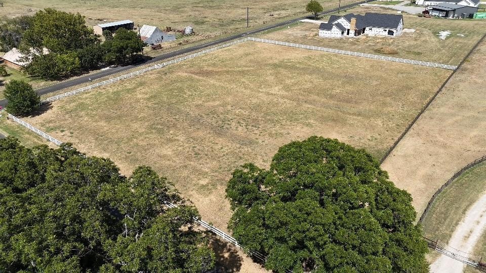 Birds eye view of property featuring a rural view