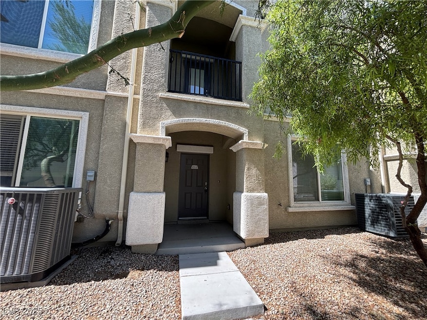 Doorway to property featuring stucco siding