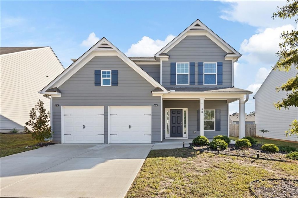 Craftsman-style home featuring a front lawn, cover