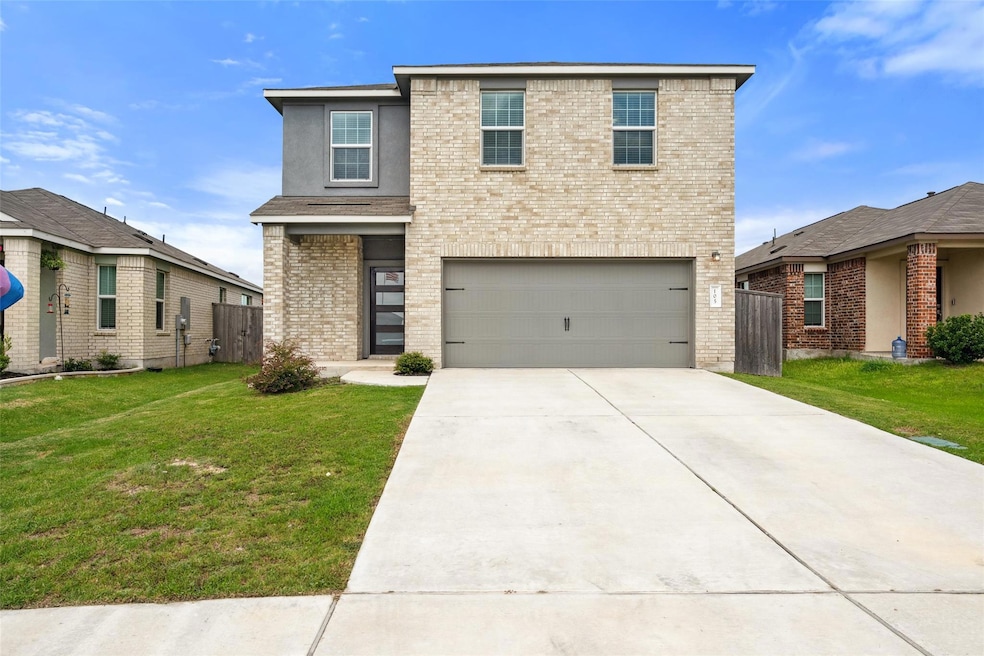 Traditional-style home with brick siding, concret