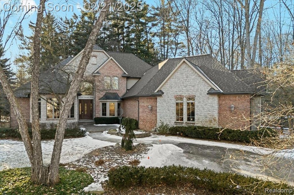 Stunning Cape Cod in serene wooded setting.