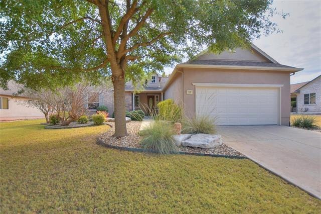 A wide lot creates plentiful privacy at the fenced rear yard of this delightful Sun City Texas Burnet, where off the Great Room resides a charming Study/Computer Room  viewing the pretty back yard setting.