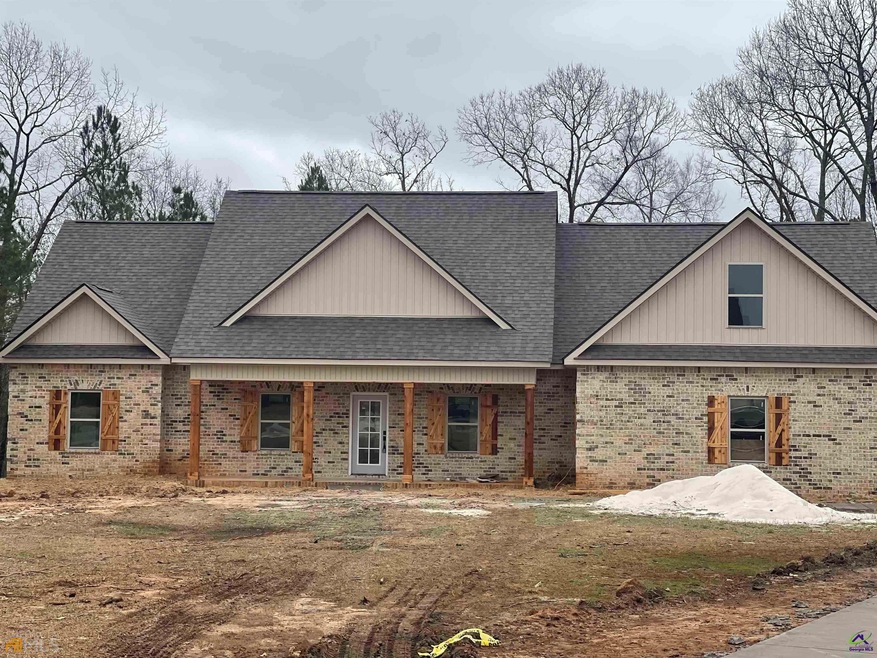 BRICK BEAUTY RESTS ON OVER A 1 ACRE LEVEL LOT