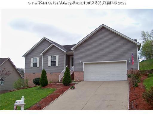 Exterior Front. One floor plan on large lot.