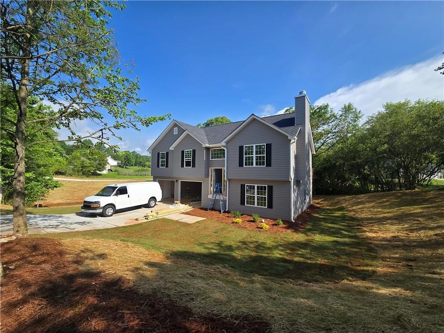 Split foyer home featuring an attached garage, a c