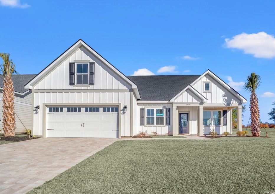 Modern farmhouse featuring a front lawn