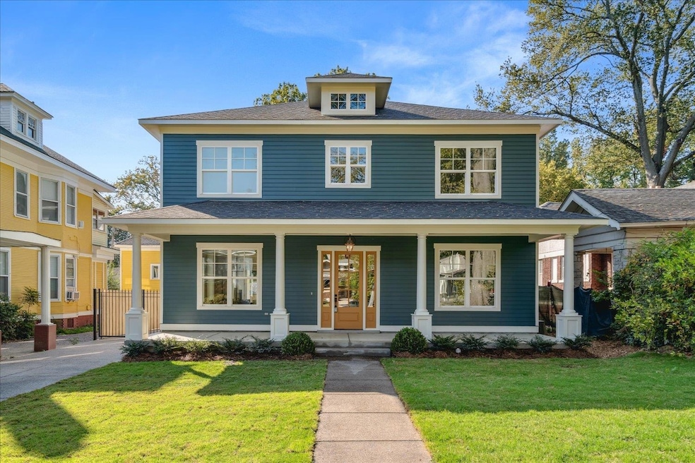 View of front of home featuring a porch and a front lawn