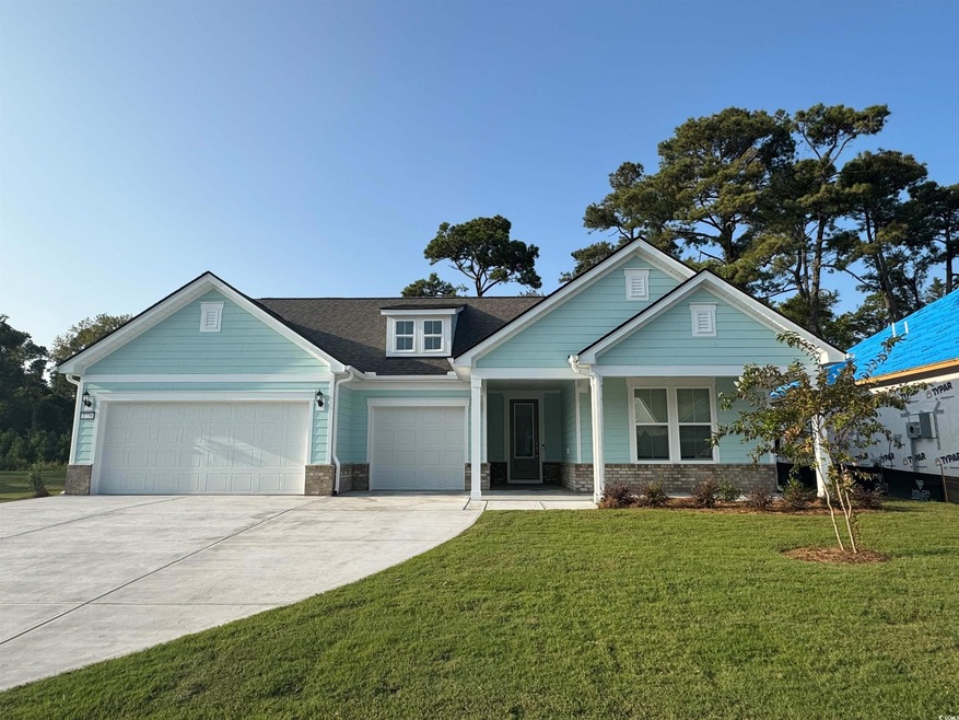 Craftsman-style house with a front lawn, a garage,