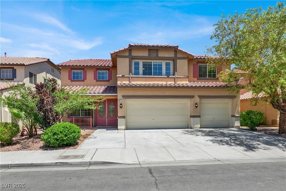 View of front of house with a garage, stucco sidin