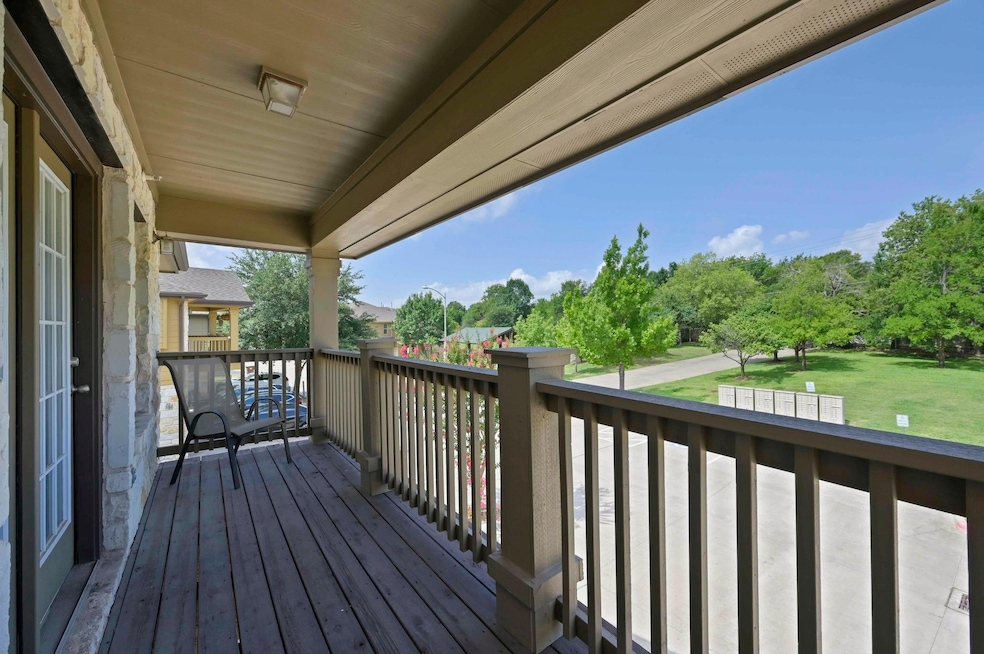 Wooden terrace featuring a yard