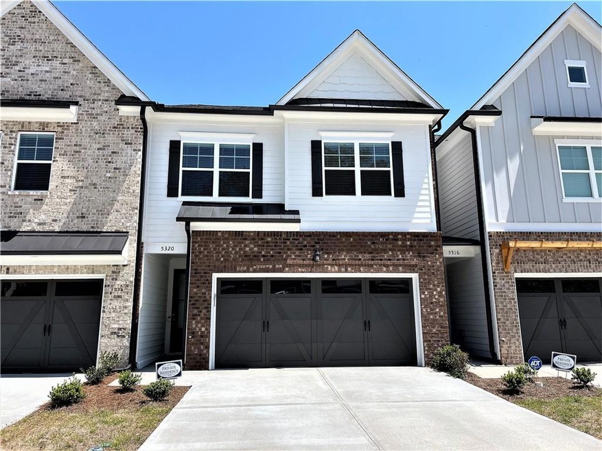 Townhome / multi-family property featuring a garag