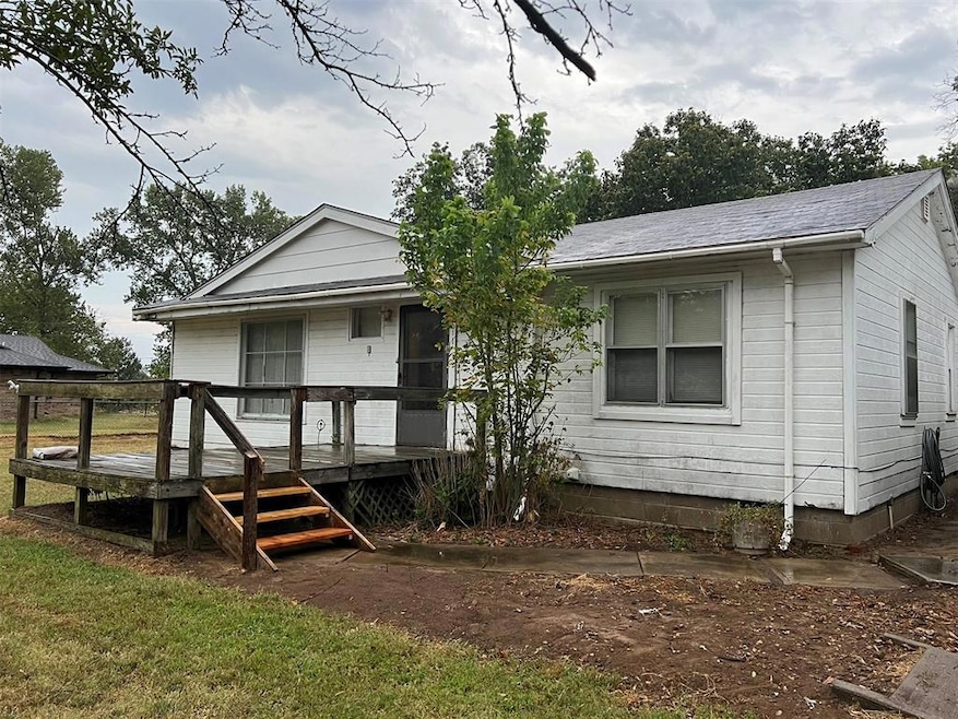 Back of house with a wooden deck