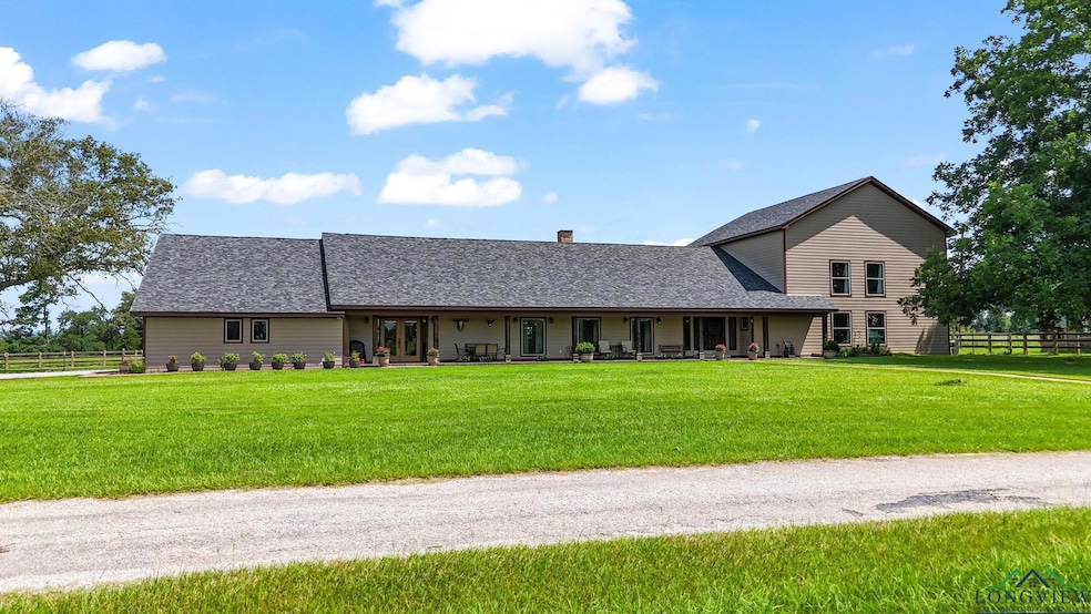View of front of home with a shingled roof