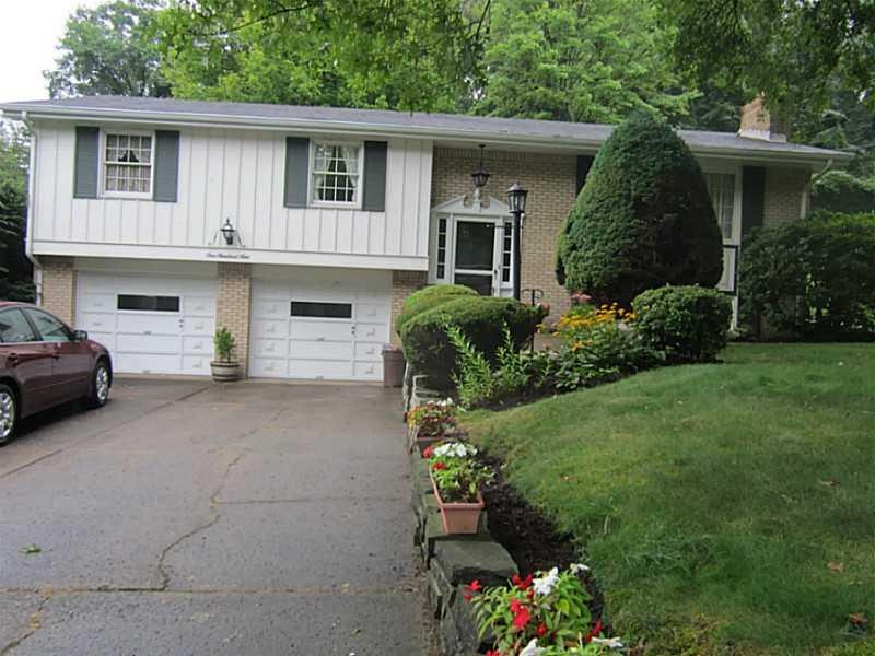Exterior Front. Level driveway! 2 car garage