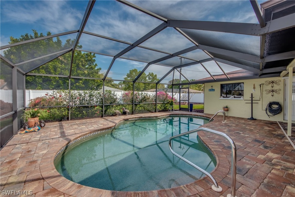 Wonderful outdoor area at this SE Cape Coral home. Free form pool has been resurfaced and is solar heated. Solar cover is available. Plenty of paver decking for sunning.