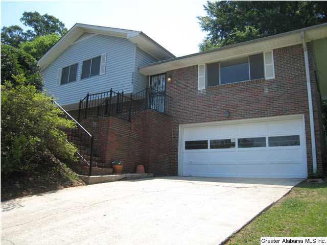 Front showing driveway and garage.  There is a pri