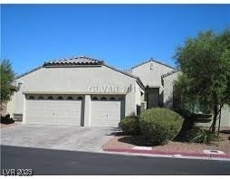 View of front facade with driveway and an attached