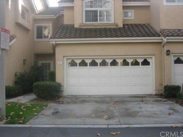 FRONT OF HOUSE WITH 2 CAR GARAGE AND DRIVEWAY
