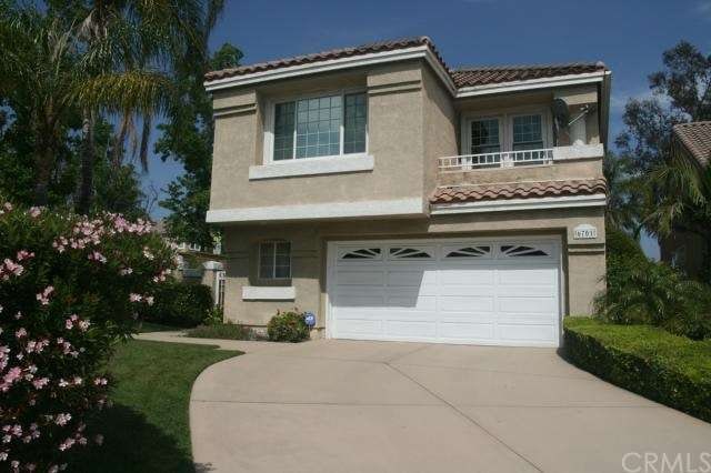 Front View shows stained concrete driveway