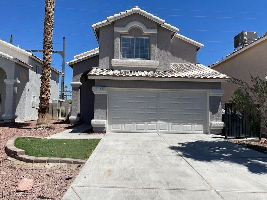 Traditional home with concrete driveway, central a
