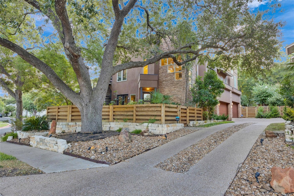 View of front of house featuring stone siding, st