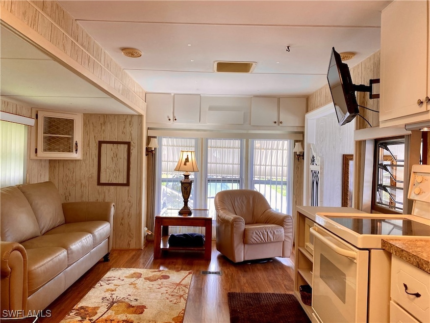 Living room/Kitchen with wood-type flooring