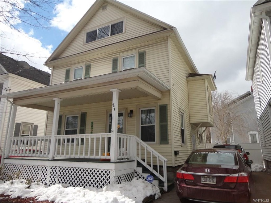 Front exterior, with full length open front porch!