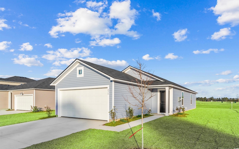 Ranch-style house with concrete driveway, a front yard, and an attached garage