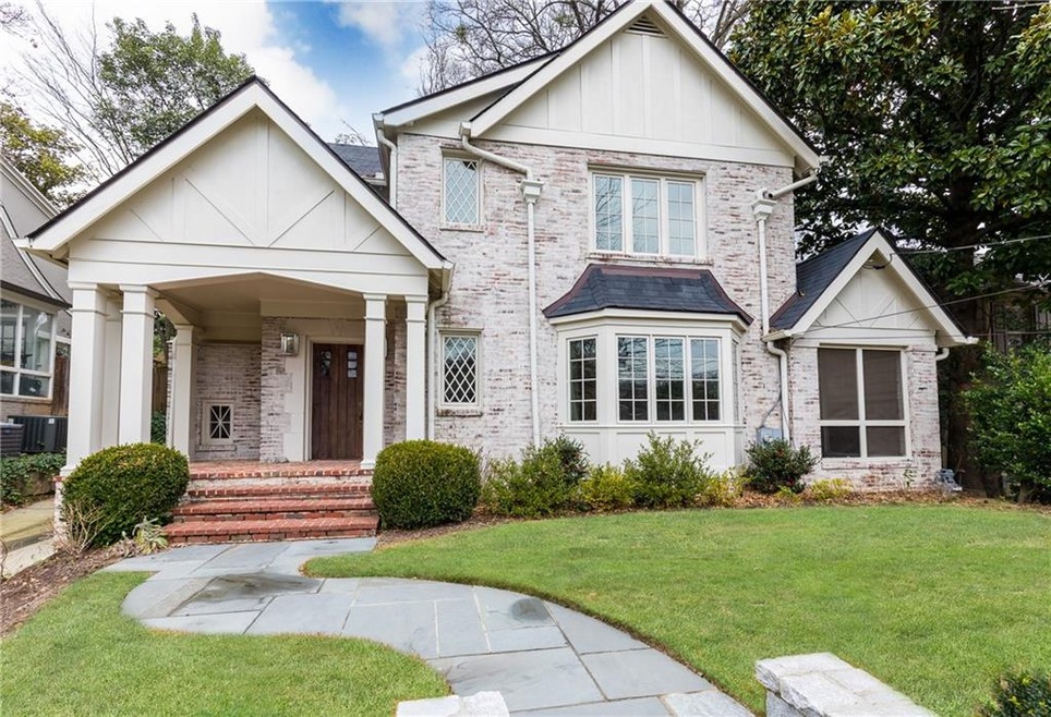 Gorgeous brick exterior with covered front porch e