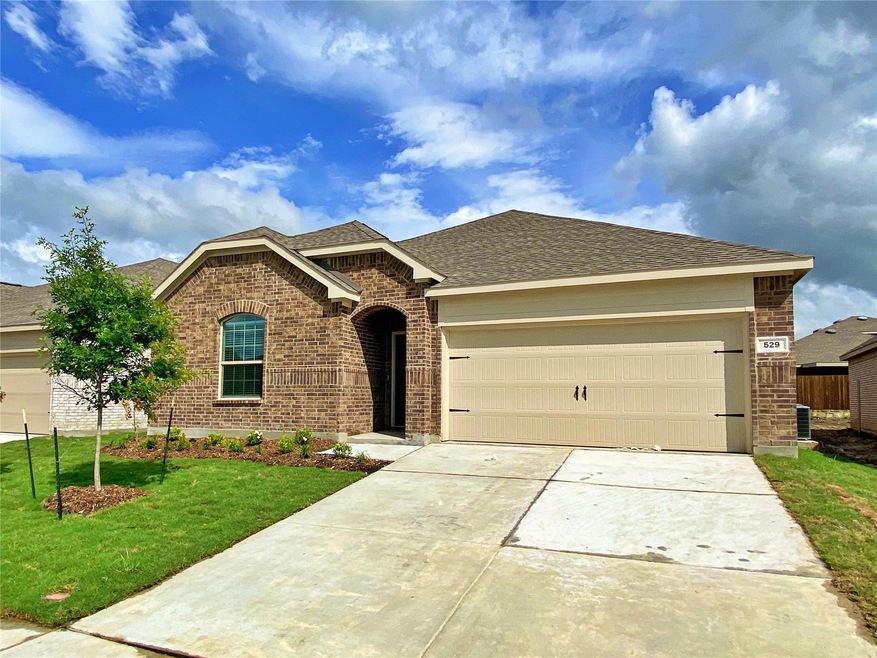 View of front of property with a front lawn and a garage