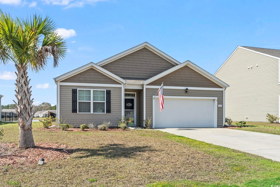 View of front of home featuring concrete driveway,